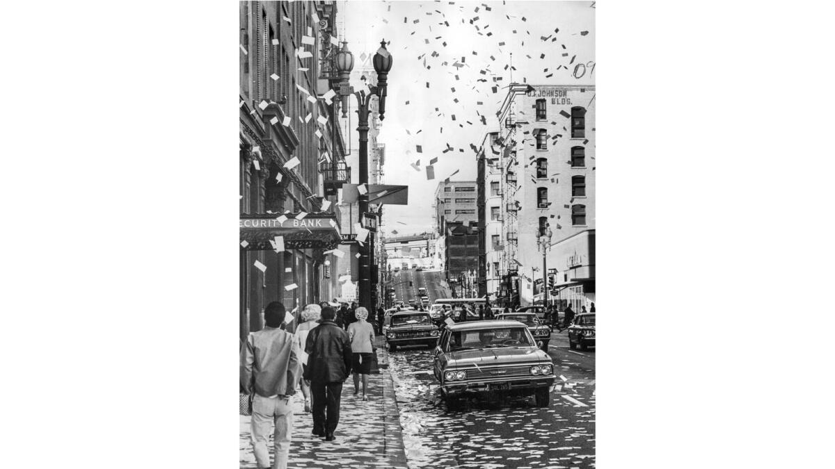 Pages from desk calendars litter the streets after being tossed out of windows on 4th Street between Spring and Main in downtown Los Angeles in 1968.