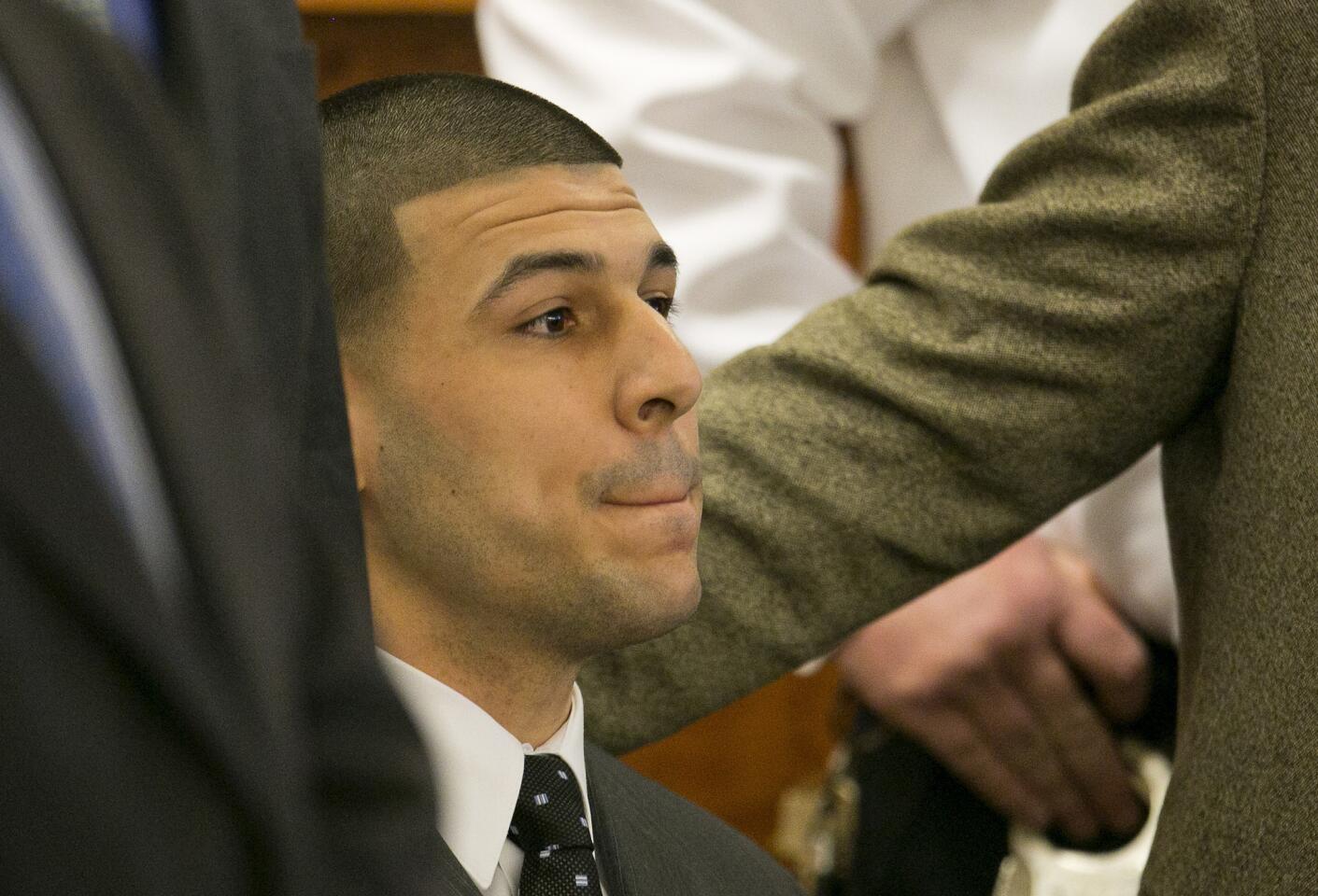 Former New England Patriots football player Aaron Hernandez listens as the guilty verdict is read during his murder trial, Wednesday, April 15, 2015 at Bristol County Superior Court in Fall River, Mass. Hernandez was found guilty of first-degree murder in the shooting death of Odin Lloyd in June 2013. He faces a mandatory sentence of life in prison without parole.