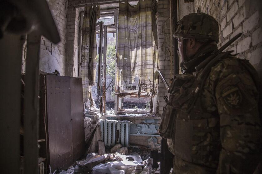 A Ukrainian soldier stands in a position during heavy fighting on the front line in Severodonetsk, the Luhansk region, Ukraine, Wednesday, June 8, 2022. (AP Photo/Oleksandr Ratushniak)