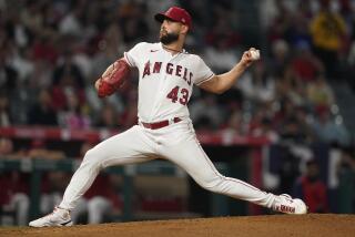 Angels starting pitcher Patrick Sandoval throws against the Rangers on Monday. 