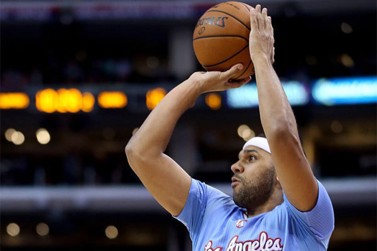 Clippers forward Jared Dudley puts up a jump shot against Philadelphia.