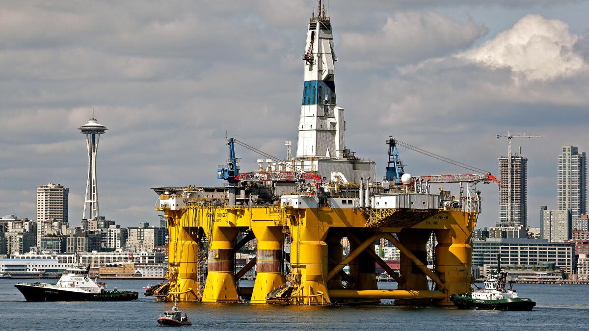 The oil drilling rig Polar Pioneer is towed toward a dock in Seattle's Elliott Bay in 2015.