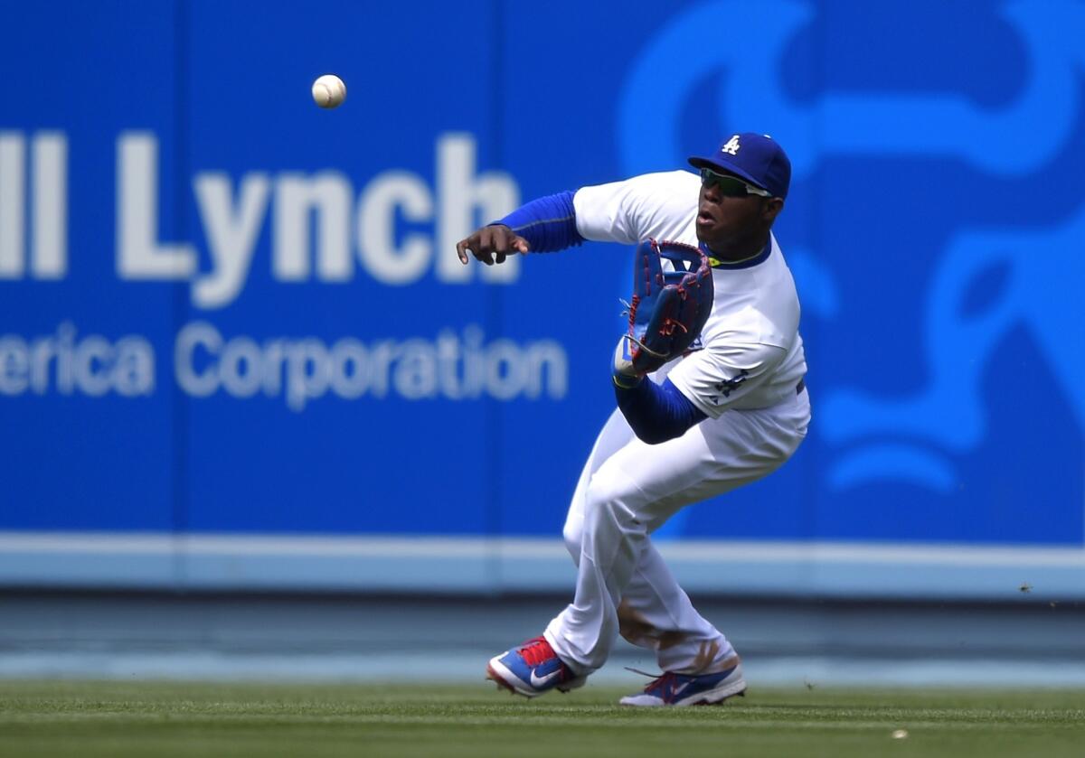 The Los Angeles Dodgers are among the state's professional sports teams that want to change a 2001 voter-approved law to offer bigger raffle pots. Above, Dodgers outfielder Yasiel Puig.