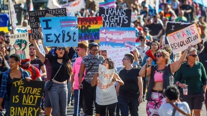 Transgender activists and supporters marched Saturday during the "Won't Be Erased" protest against the federal government's move to more narrowly define gender as male or female.