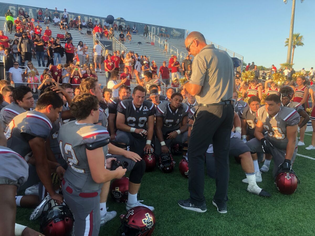 JSerra coach Pat Harlow addresses team after 17-14 comeback win over Milton on Saturday.