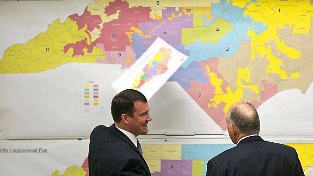 Republican state Sens. Dan Soucek, left, and Brent Jackson review historical maps of North Carolina in 2016.