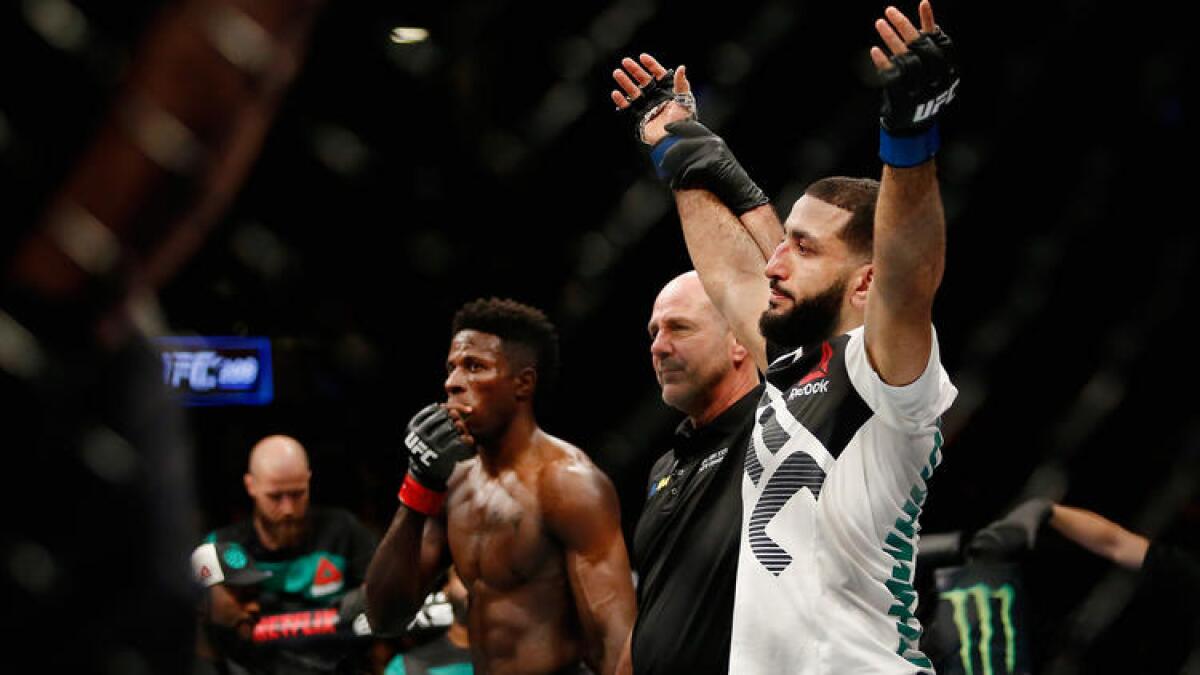 Belal Muhammad reacts after hearing he defeat Randy Brown by unanimous decision in a welterweight bout at UFC 208.