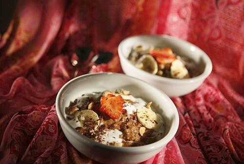 Hazelnut-chocolate oatmeal with strawberries and cream.
