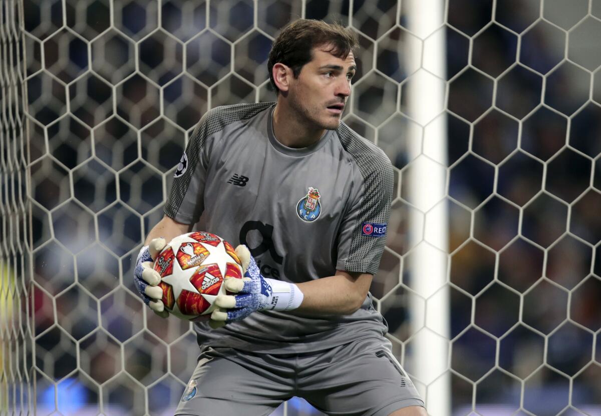 Iker Casillas holds the ball during their Champions League quarterfinals, 2nd leg, soccer match against Liverpool at the Dragao stadium in Porto, Portugal. Veteran goalkeeper Iker Casillas has had a heart attack but is out of danger, Porto said Wednesday, May 1. The Portuguese club said Casillas fell ill during a practice session and remains hospitalized, but the “heart condition has been resolved.” (AP Photo/Luis Vieira, file)