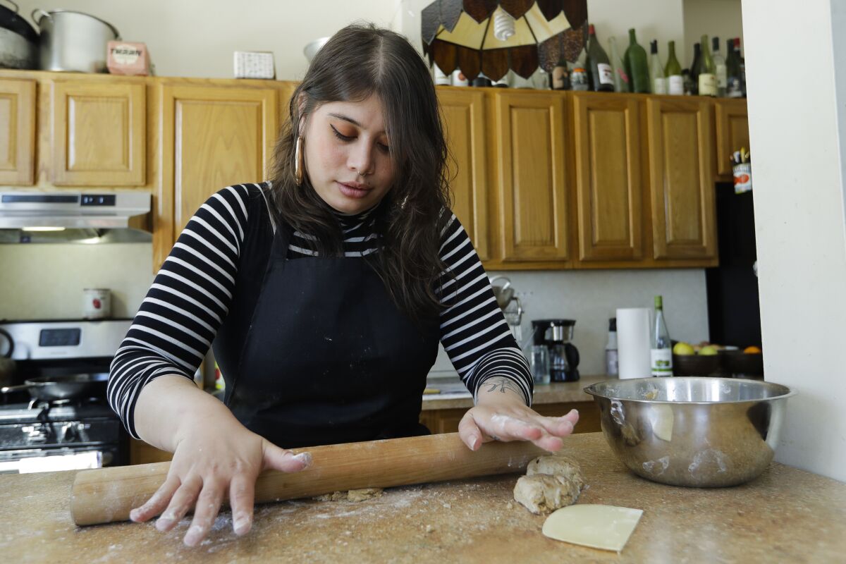 Gabby Namm prepares flat bread in Queens, New York. 