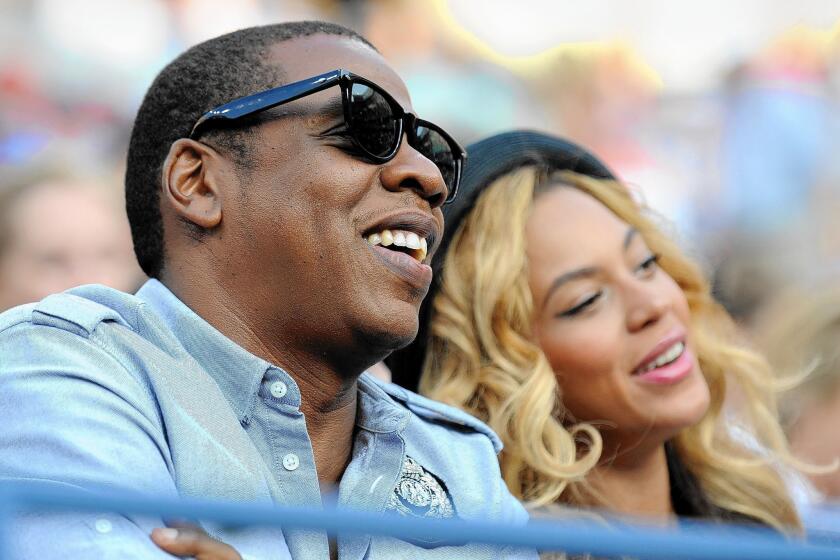 A video containing footage of Jay-Z used to support Proposition 47 is the subject of a campaign penalty. The entertainment mogul is seen here with his wife, Beyoncé.