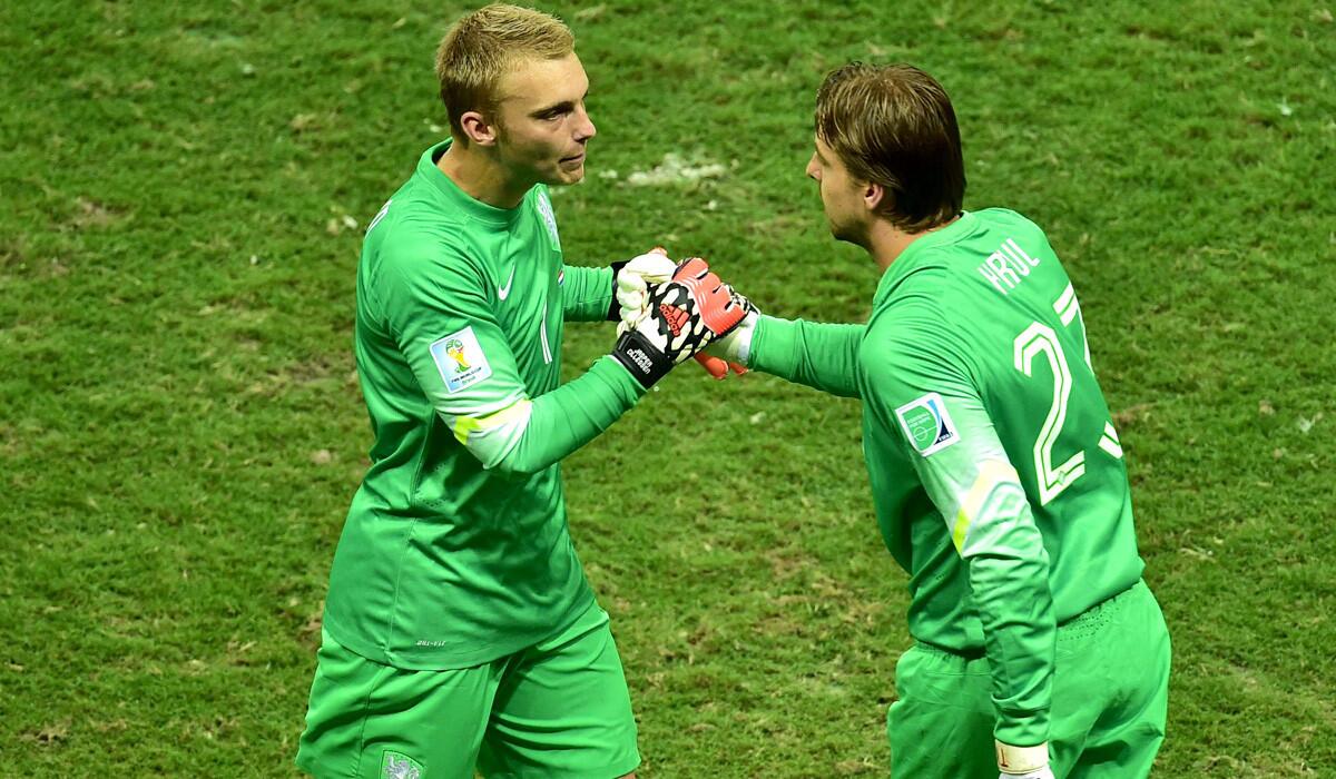 Netherlands starting goalkeeper Jasper Cillessen, left, was replaced by reserve goalkeeper Tim Krul late in the team's World Cup quarterfinal game against Costa Rica.