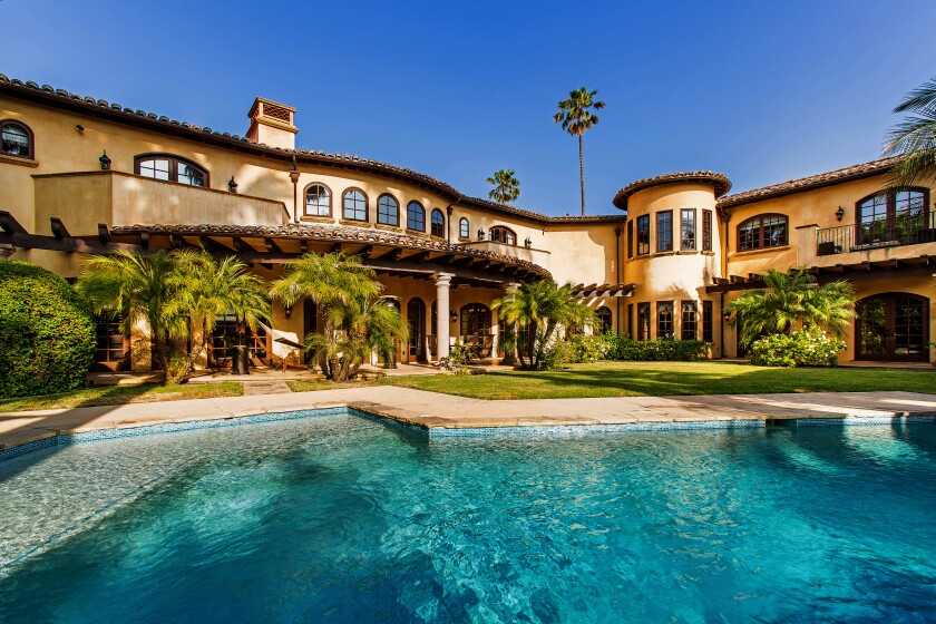 Swimming pool and an exterior view of Milton Bradley's former Encino home