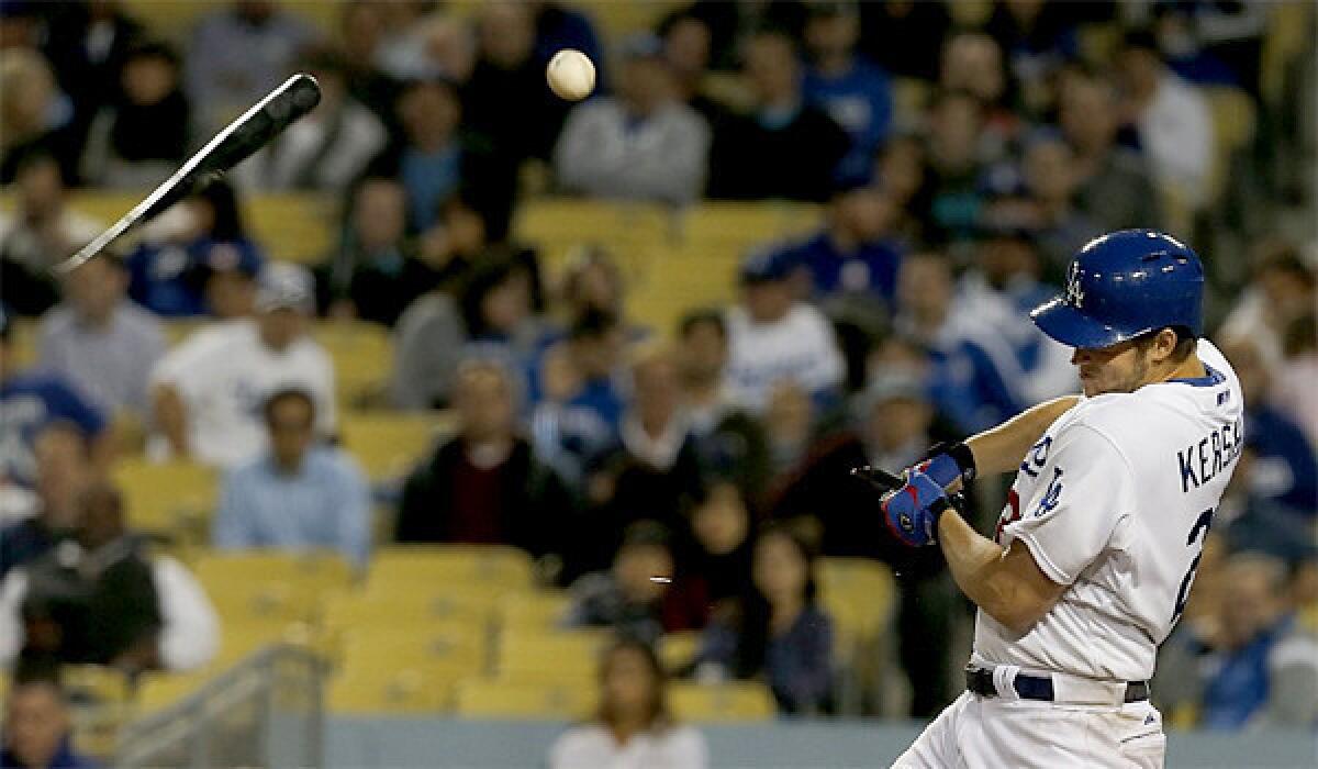 Clayton Kershaw, who delivered a solid pitching performance Wednesday, bats against the Arizona Diamondbacks.