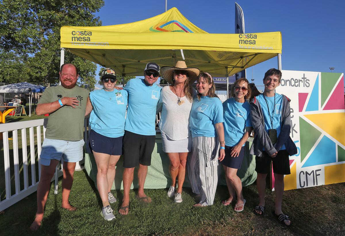 Members of the Costa Mesa Foundation in the beer and wine garden of Costa Mesa's annual Concerts in the Park series Tuesday.