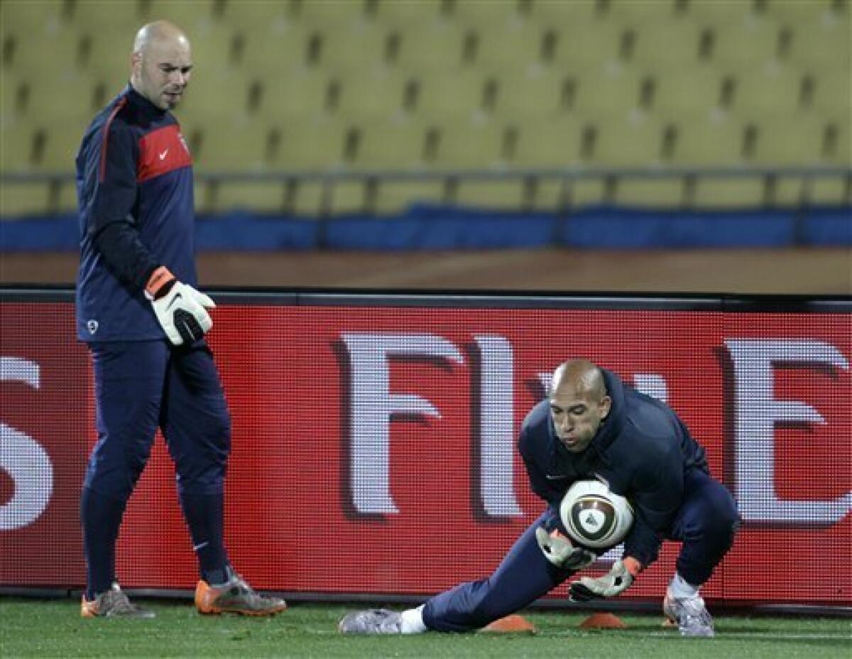 U.S. national soccer goalkeeper Marcus Hahnemann, left, watches Tim Howard as they train at Royal Bafokeng Stadium in Rustenburg, South Africa Friday, June 11, 2010. The U.S. will play England in a soccer World Cup Group C match on Saturday. (AP Photo/Elise Amendola)