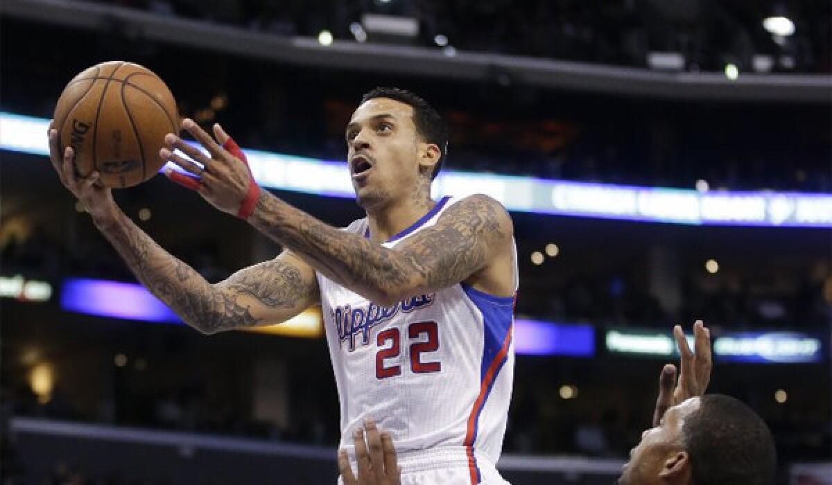 Matt Barnes drives to the basket past the New Orleans Hornets' Dominic McGuire during the Clippers 11th consecutive win Wednesday.
