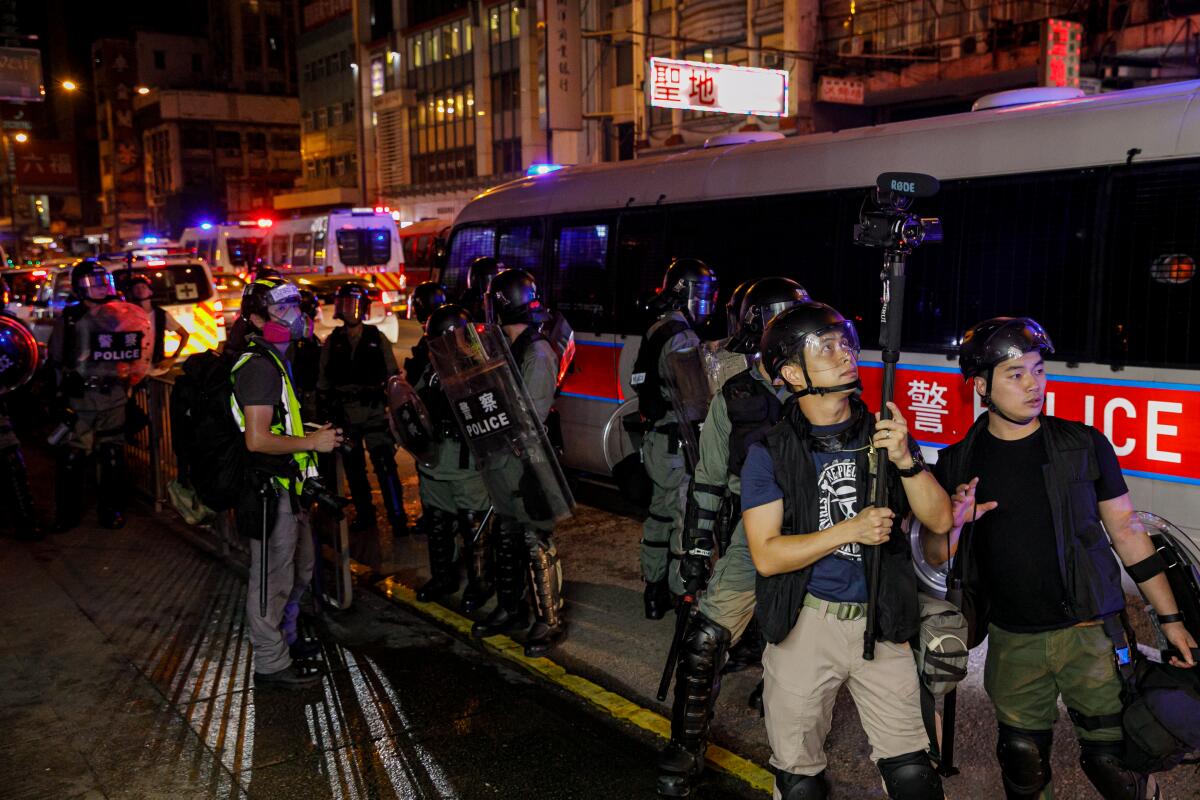 Police and protesters in Hong Kong