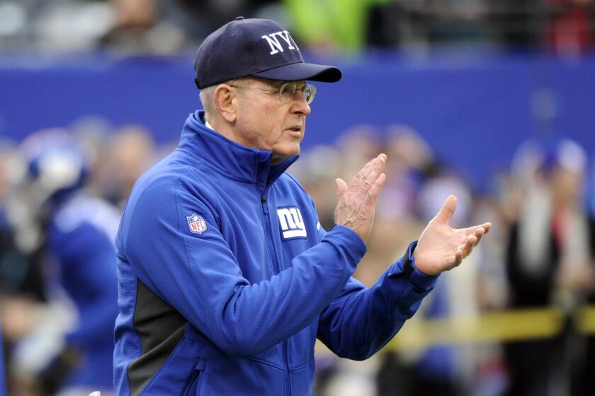 New York Giants Coach Tom Coughlin watches his team warm up before a Dec. 28 game against the Philadelphia Eagles in East Rutherford, N.J.