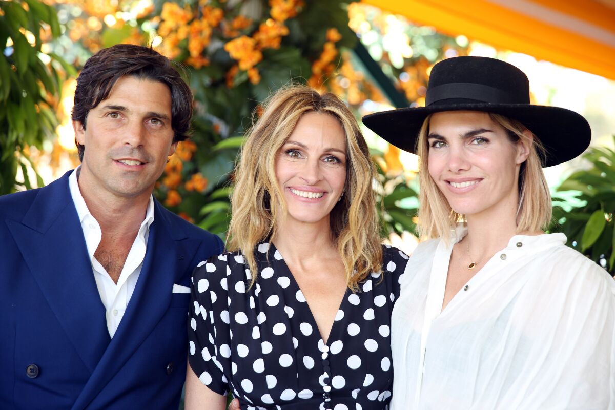 Argentine polo player Nacho Figueras, left, and his wife, Delfina Blaquier, right, also a polo player, join Julia Roberts for the 10th anniversary of the Veuve Clicquot Polo Classic at Will Rogers Park on Saturday.