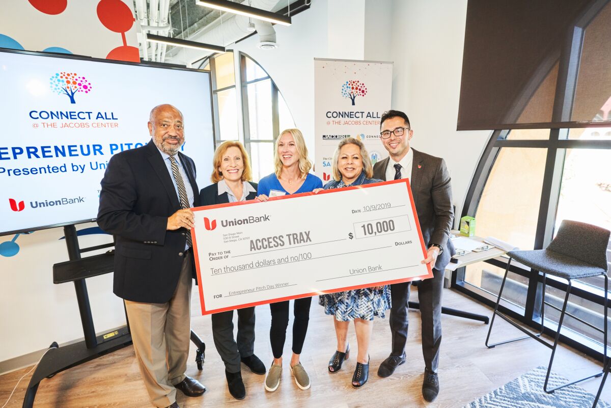 Reginald Jones, Jacobs Center president and CEO; Valerie Jacobs Hapke, board member of the Jacobs Center for Neighborhood Innovation; Kelly Twichel, founder and grand prize winner, Access Trax; Lydia Moreno, City of San Diego deputy director, economic development; and Union Bank regional president for San Diego Isai Amaya at the inaugural Entrepreneur Pitch Day Competition.