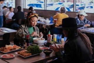 VAN NUYS, CA - NOVEMBER 09: Jeannie Mai enjoys a meal at the restaurant Pho So 1 with Jen Harris during their Vietnamese food crawl in the San Fernando Valley on Wednesday, Nov. 9, 2022 in Van Nuys, CA. (Jason Armond / Los Angeles Times)