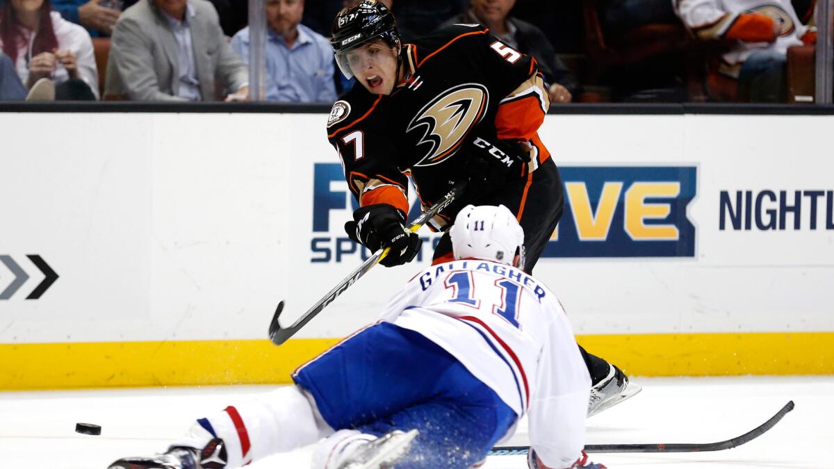 Ducks left wing David Perron shoots the puck past Canadiens right wing Brendan Gallagher during overtime at Honda Cetner on March 2.