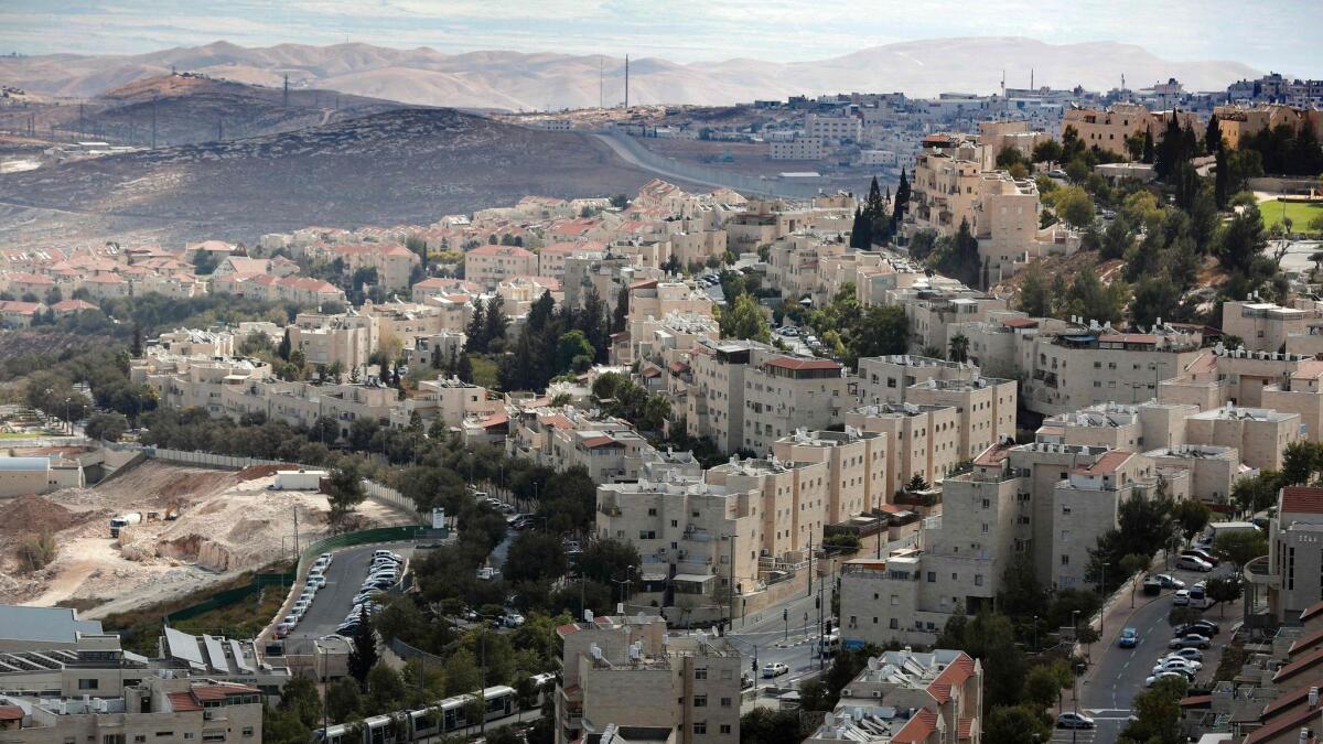 The Israeli settlement of Pisgat Zeev in East Jerusalem, center, and the West bank village of Anata, top right, on Sept. 27, 2016.