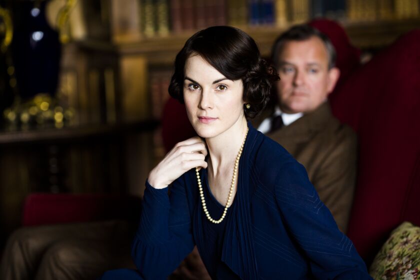 Michelle Dockery as Lady Mary Crawley and Hugh Bonneville as Robert, Earl of Grantham in the "Downton Abbey" series.