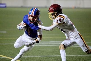 Garfield receiver Isaak Naranjo beats Roosevelt’s Christopher Rodriguez to the pylon for a touchdown Friday night.