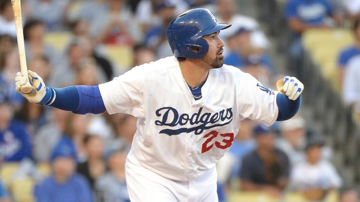 Dodgers first baseman Adrian Gonzalez hits a two-run home run during the first inning of the team's 10-3 loss to the Cleveland Indians at Dodger Stadium.