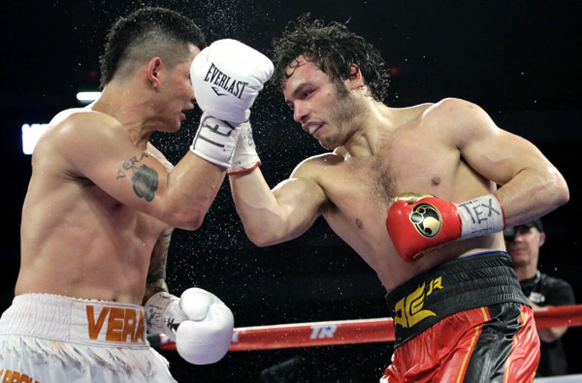 Julio Cesar Chavez Jr., right, delivers a punch to Bryan Vera during their super-middleweight bout on Saturday in San Antonio.