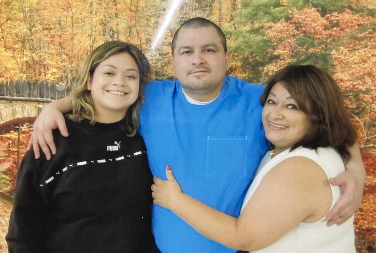 Lombardo Palacios is shown last year with his sister, Sigry Ortiz, left, and his mother, Claudia Ortiz.