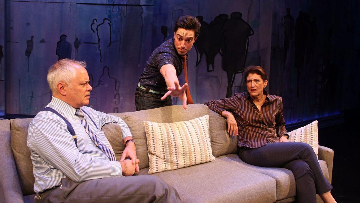 Ethan (Ben Feldman) talks to his ex's puzzled parents (Matthew Arkin and Amy Aquino) in "The Siegel."
