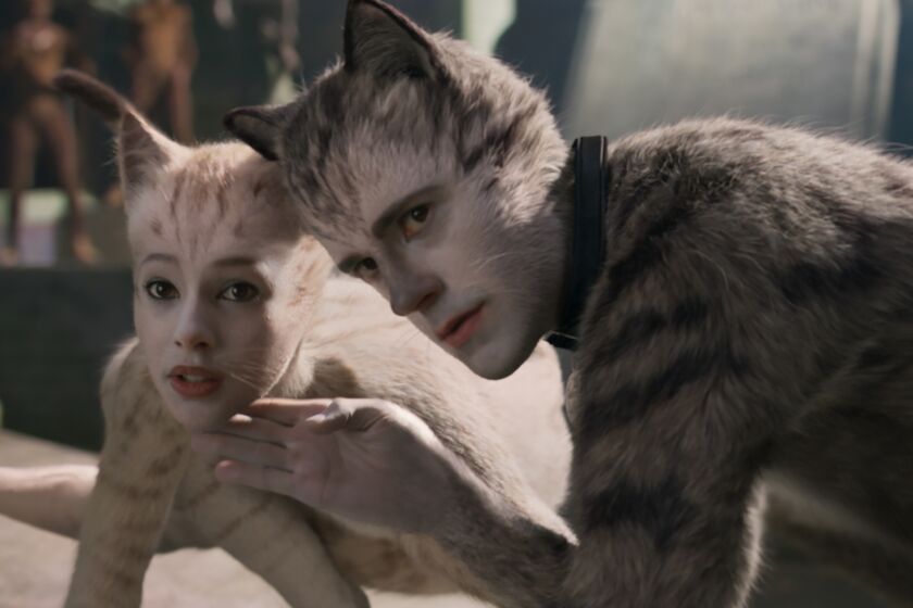 (from left) Victoria (Francesca Hayward) and Munkustrap (Robbie Fairchild) in Cats, co-written and directed by Tom Hooper. Credit: Universal Pictures