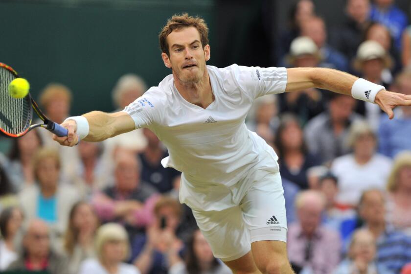 Andy Murray plays a return during his fourth-round win over Kevin Anderson at Wimbledon on Monday.