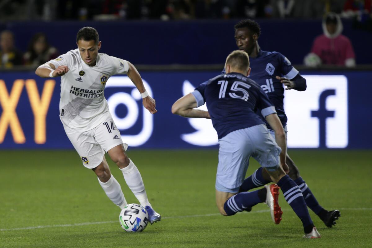 Galaxy's Javier "Chicharito" Hernandez controls the ball against Vancouver Whitecaps.