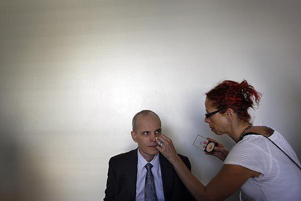 Emmy Award-winning actor Zeljko Ivanek gets a touch-up before filming a scene from NBC's conspiracy thriller "The Event," in a downtown Los Angeles building, doubling for the Bethesda Naval Hospital outside Washington, D.C., Sept. 23, 2010. Ivanek plays the director of national intelligence, Blake Sterling, under President Elias Martinez (Blair Underwood), and performs as a mysterious government figure, revealing the existence and the U.S. government detention of a group of people believed to be alien life forms that crashed to Earth in 1944.