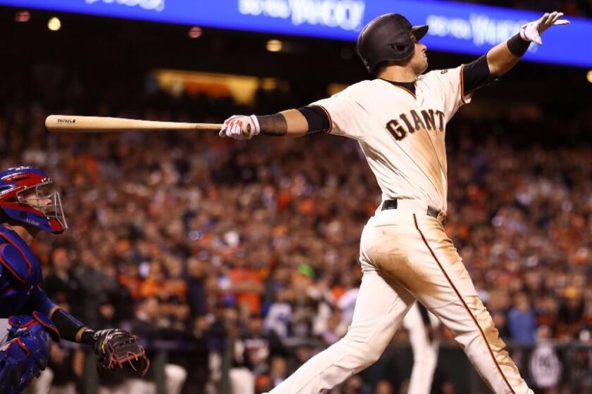 Giants infielder Joe Panik doubles home the game-winning run in the 13th inning of NLDS Game 3 against the Chicago Cubs.