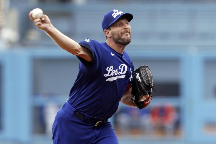 Los Angeles Dodgers starting pitcher Max Scherzer throws to a New York Mets batter during the first inning of a baseball game in Los Angeles, Saturday, Aug. 21, 2021. (AP Photo/Alex Gallardo)