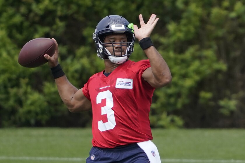 Seattle Seahawks quarterback Russell Wilson passes during NFL football practice Tuesday, June 8, 2021, in Renton, Wash. (AP Photo/Ted S. Warren)