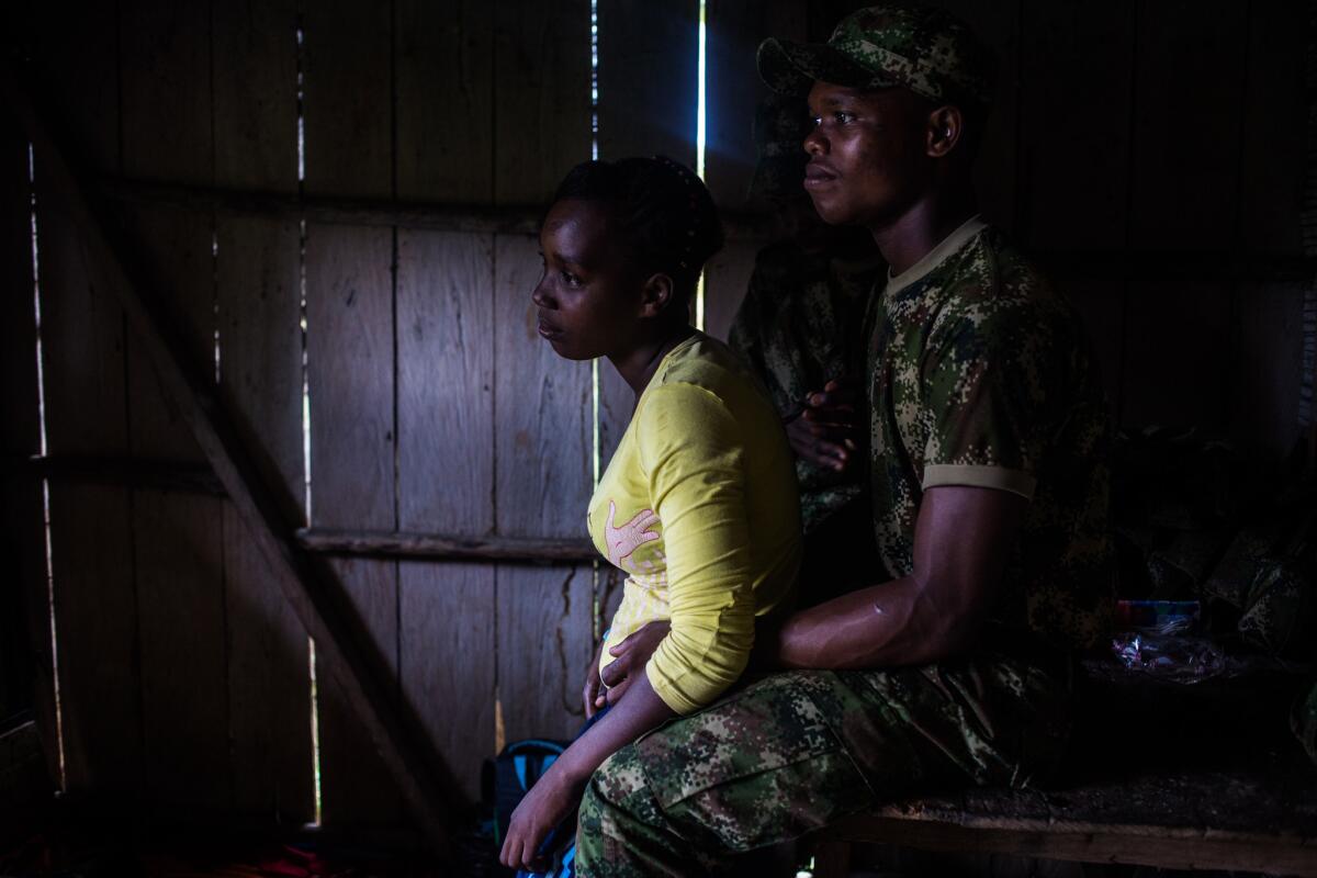 A woman visits her husband who lives with other guerrilla members. They have a 1-year-old son.