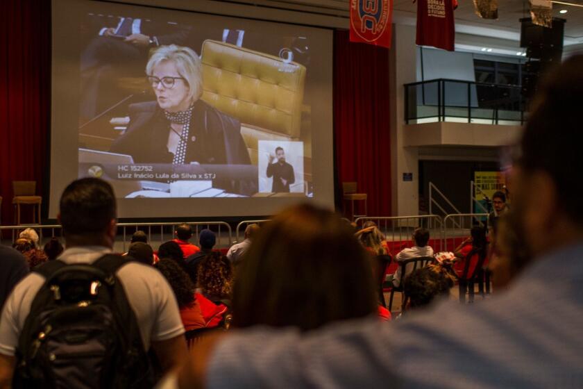 SAO PAULO, BRAZIL - APRIL 04: Supporters of former President Luiz Inacio Lula da Silva watch Justice Rosa Weber, whose position had not been known but who voted at a session of the Federal Supreme Court that da Silva should be jailed following his conviction on corruption charges, on television at the headquarters of the Metalworkers' Union on April 4, 2018 in Sao Bernardo do Campo, Sao Paulo, Brazil. The court ruled 6-5 that da Silva, 72, can be sent to prison while he continues his appeal of his correcuption conviction. The ruling delivers a serious blow to da Silva's bid as candidate in this year's presidential election. (Photo by Victor Moriyama/Getty Images) ** OUTS - ELSENT, FPG, CM - OUTS * NM, PH, VA if sourced by CT, LA or MoD **