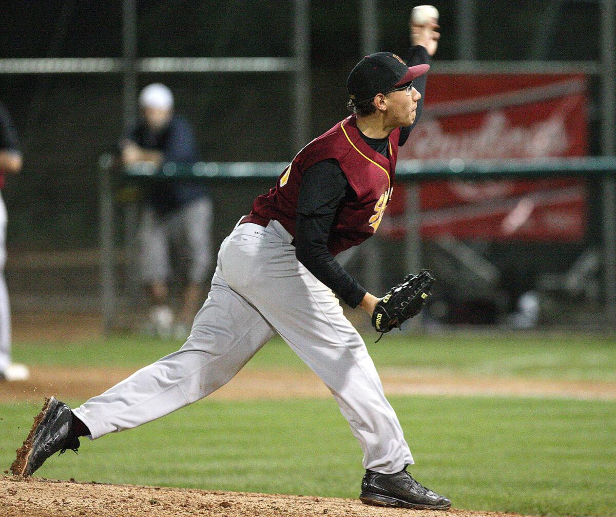 La Cañada pitcher Justin Lewis throws a pitch during a game at Stengel Field on Tuesday, March 4, 2014.