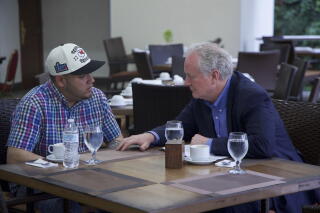 Maryland Sen. Chris Van Hollen, right, speaks with Kilmar Abrego Garcia