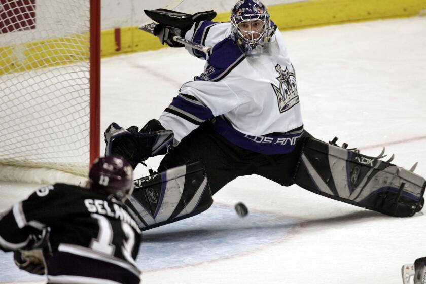 Kings goalie Mathieu Garon stops a shot from Ducks forward Teemu Selanne during the second period of a game on Dec. 16, 2005.