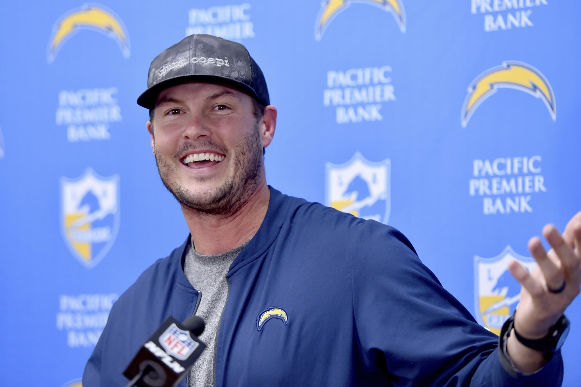 Chargers quarterback Philip Rivers smiles at a news conference in December 2019.
