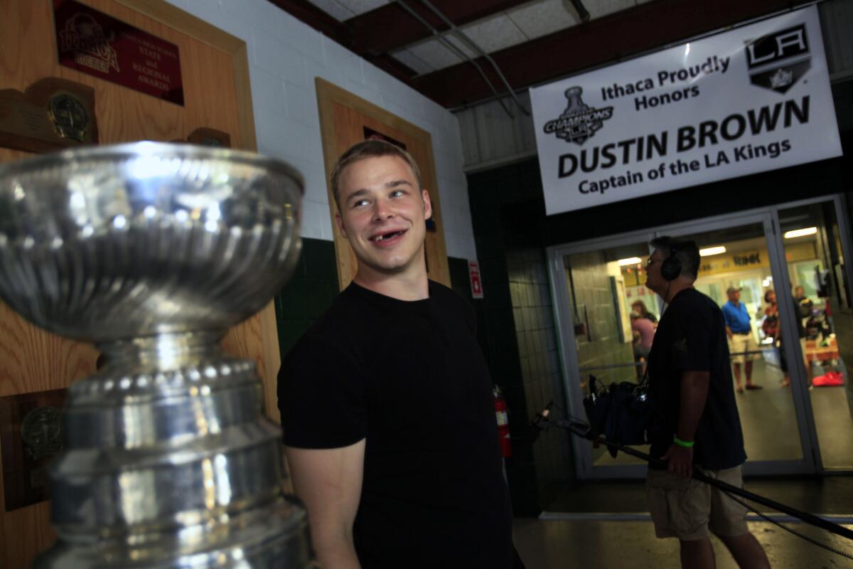 Kings forward Dustin Brown -- with the Stanley Cup close by -- visits the rink in Ithaca, N.Y., where he played as a youngster.
