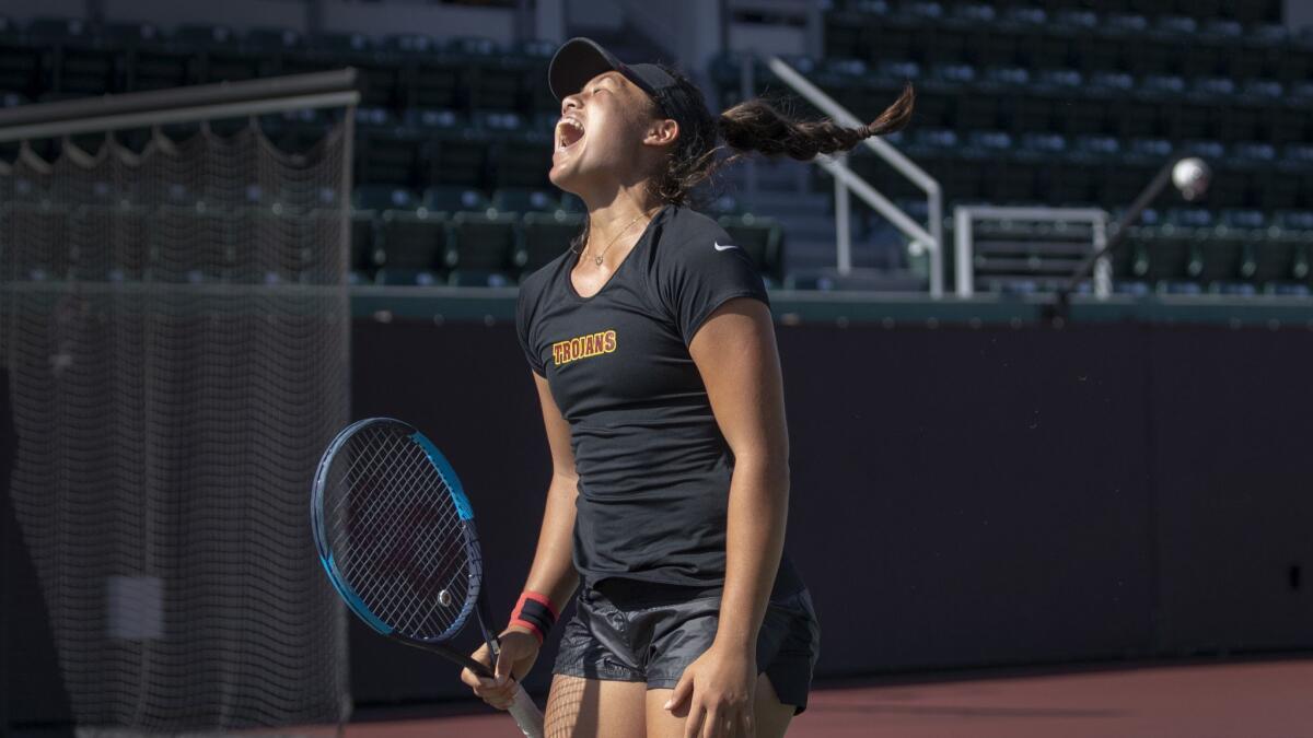 USC tennis player Angela Kulikov gets fired up during a doubles game. Kulikov also plays quarterback for a flag-football team and coaches her brother in football.