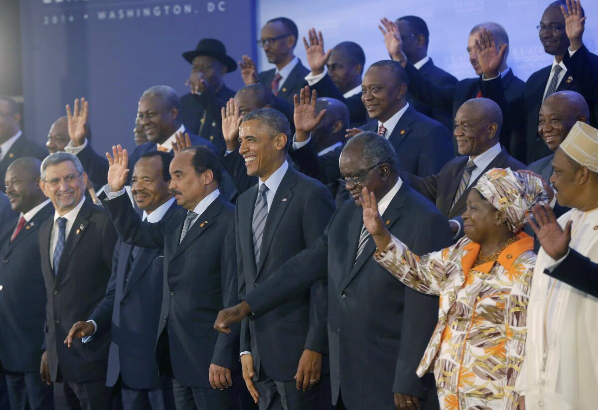 Barack Obama, center, surrounded by world leaders at a summit